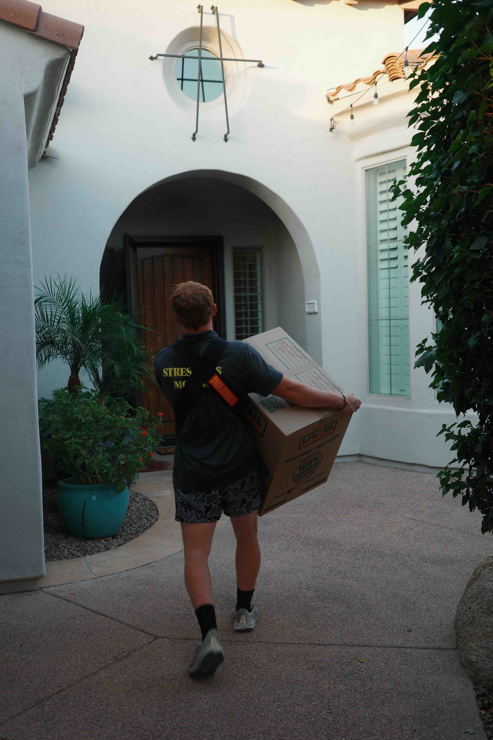 Stress Less Moving crew member carrying boxes